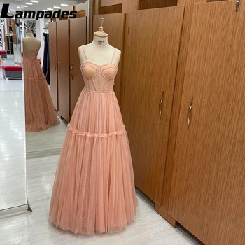 Женственное и элегантное платье для выпускного вечера А-силуэта нежно-розового цвета, идеально подходящее для официальных мероприятий и вечеринок.